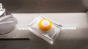 A clear glass container with a label on a countertop.