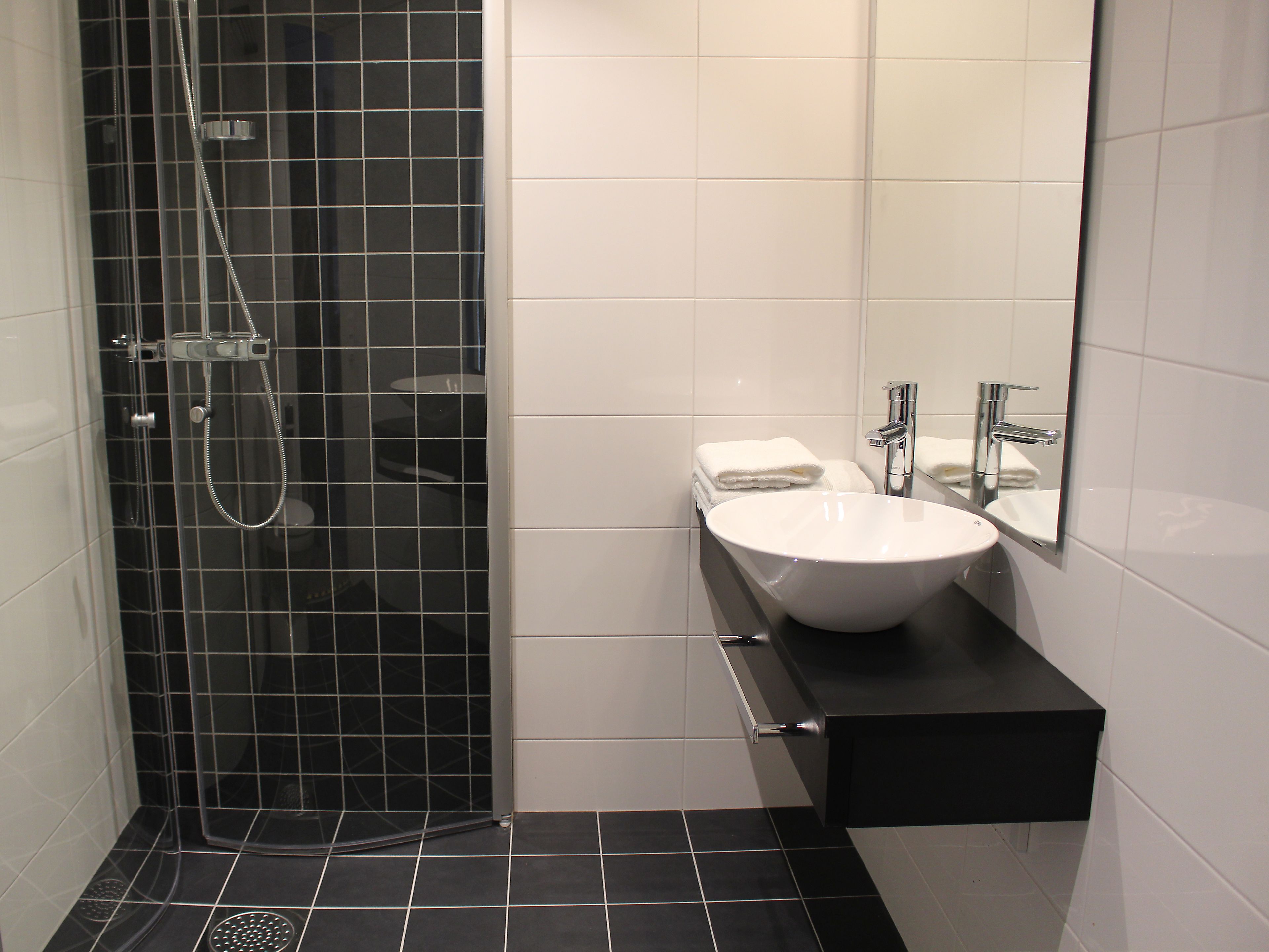 shower, hair dryer, heated floors, towels