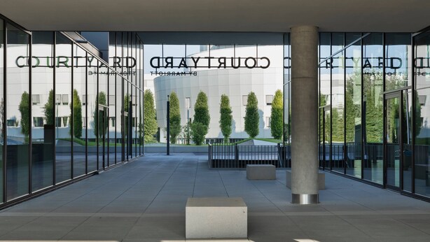 A modern building with the name 'COURTYARD' prominently displayed.