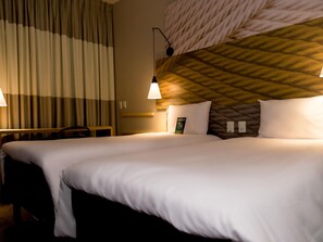 Standaard appartement, 2 eenpersoonsbedden | Een minibar, een bureau, geluiddichte muren, gratis babybedden