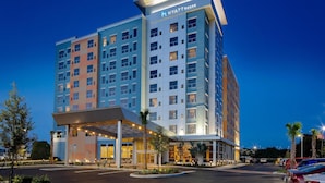 A multi-story hotel with a modern design, featuring a prominent 'Hyatt House' sign at the top.