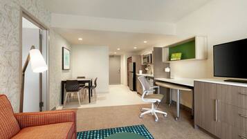 Premium bedding, desk, laptop workspace, blackout drapes