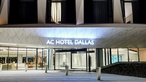 The exterior of AC Hotel Dallas with a modern design, large glass entrance, and a marble floor. - AC Hotel by Marriott Dallas by the Galleria (Dallas)
