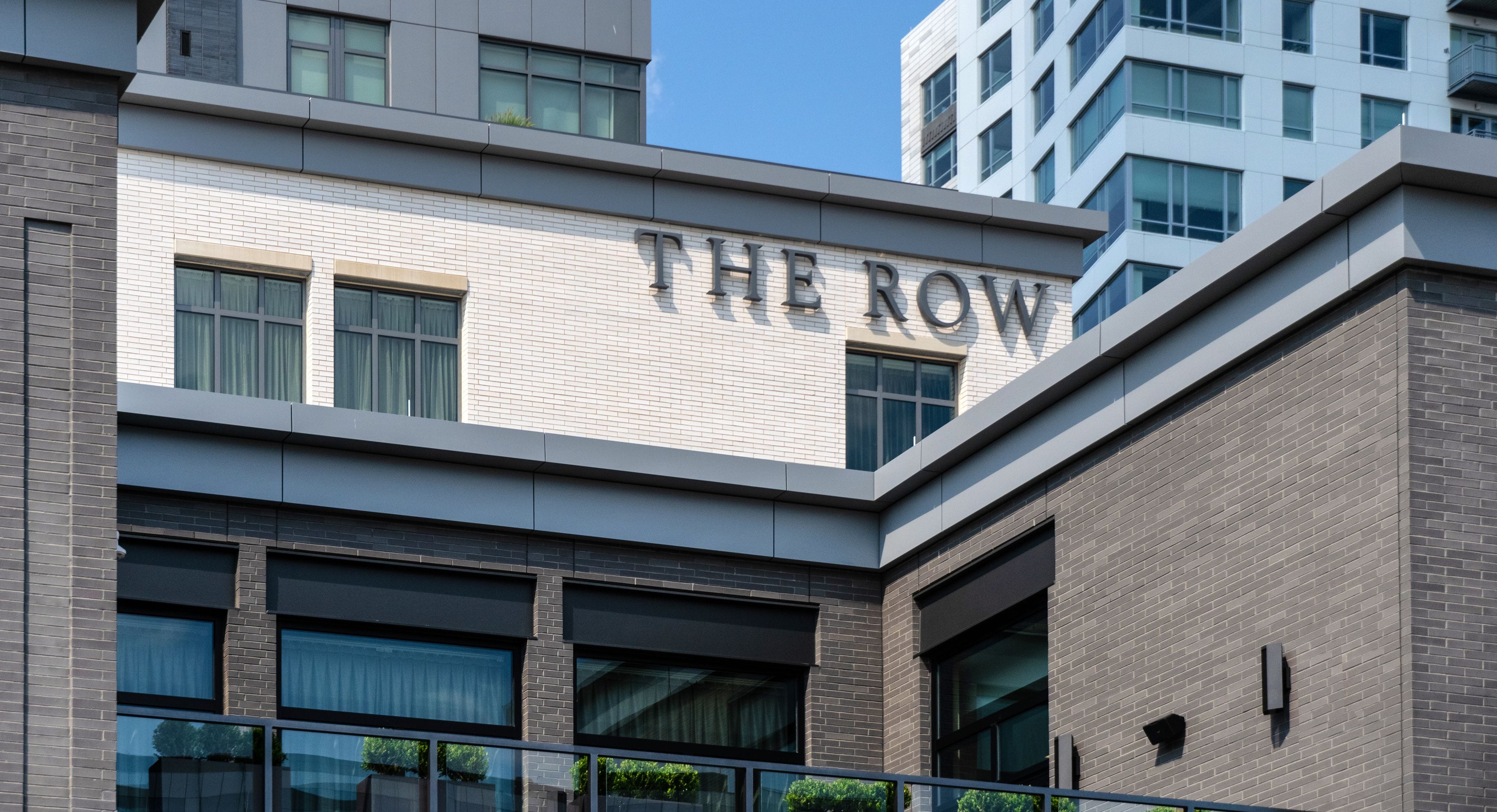 A building with "THE ROW" prominently displayed on its facade.