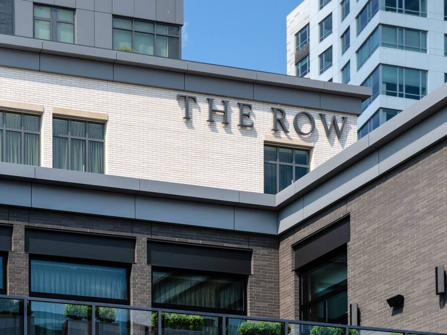 A building with "THE ROW" prominently displayed on its facade.