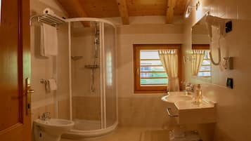 Shower, free toiletries, hair dryer, slippers