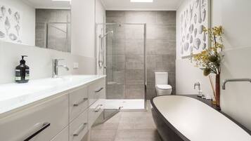 Bathtub, hair dryer, towels, soap