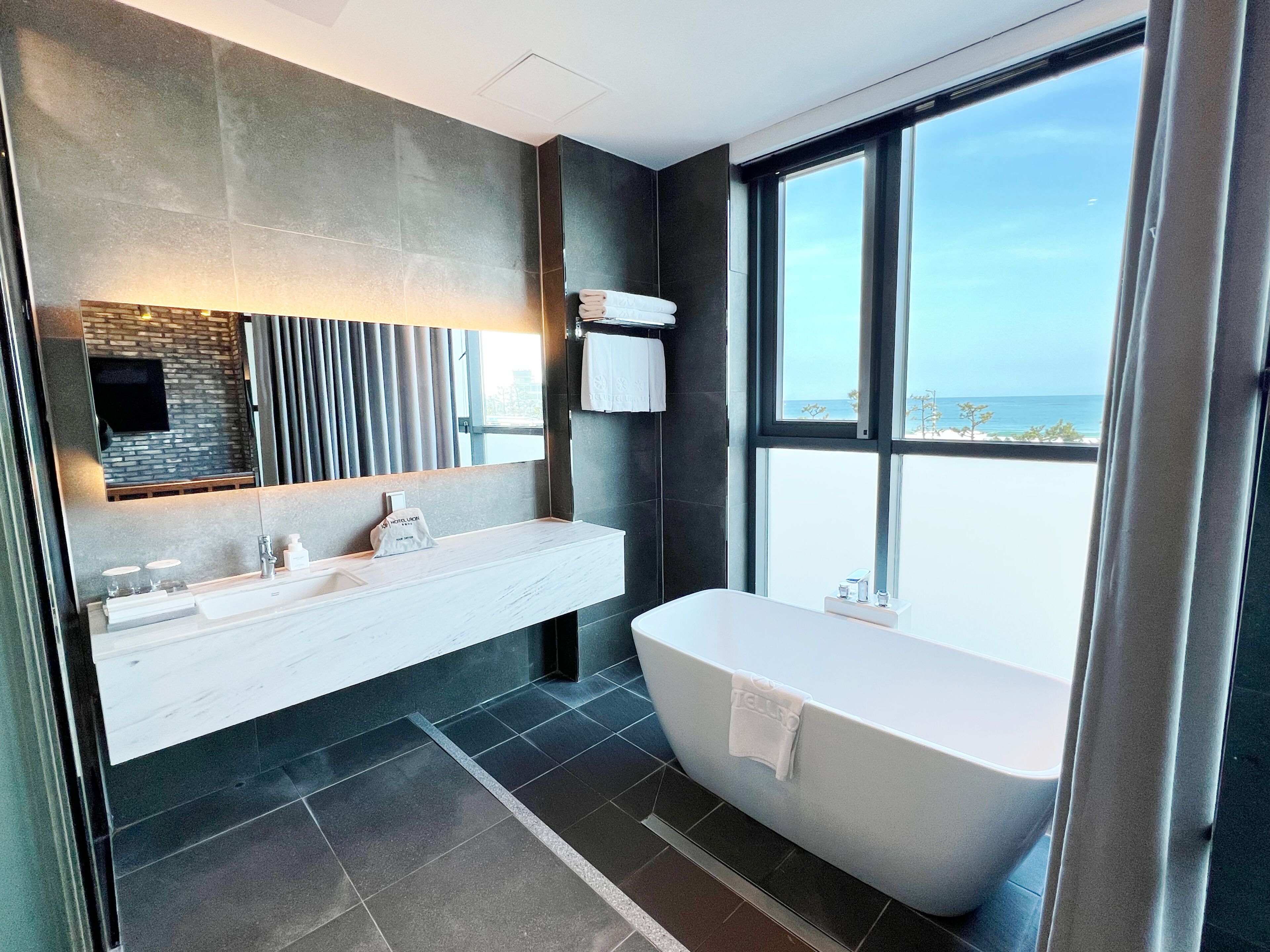 family suite, 2 double beds, non smoking, partial ocean view | bathroom | free toiletries, hair dryer, bathrobes, slippers