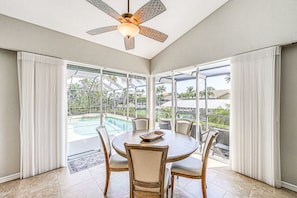 Enjoy meals with family and friends at the large dining table surrounded by six chairs.