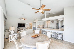 Relax in this inviting living area with a round dining table and comfortable seating for meals and socializing.