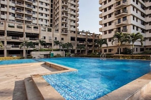 Outdoor pool, open 6 AM to 10 PM, pool umbrellas, sun loungers