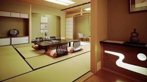 A traditional Japanese-style room with tatami flooring, a low table, and sliding doors. - Katayamazu Hot Spring Motoyu Hotel Kanoya Korakuen (Kaga)