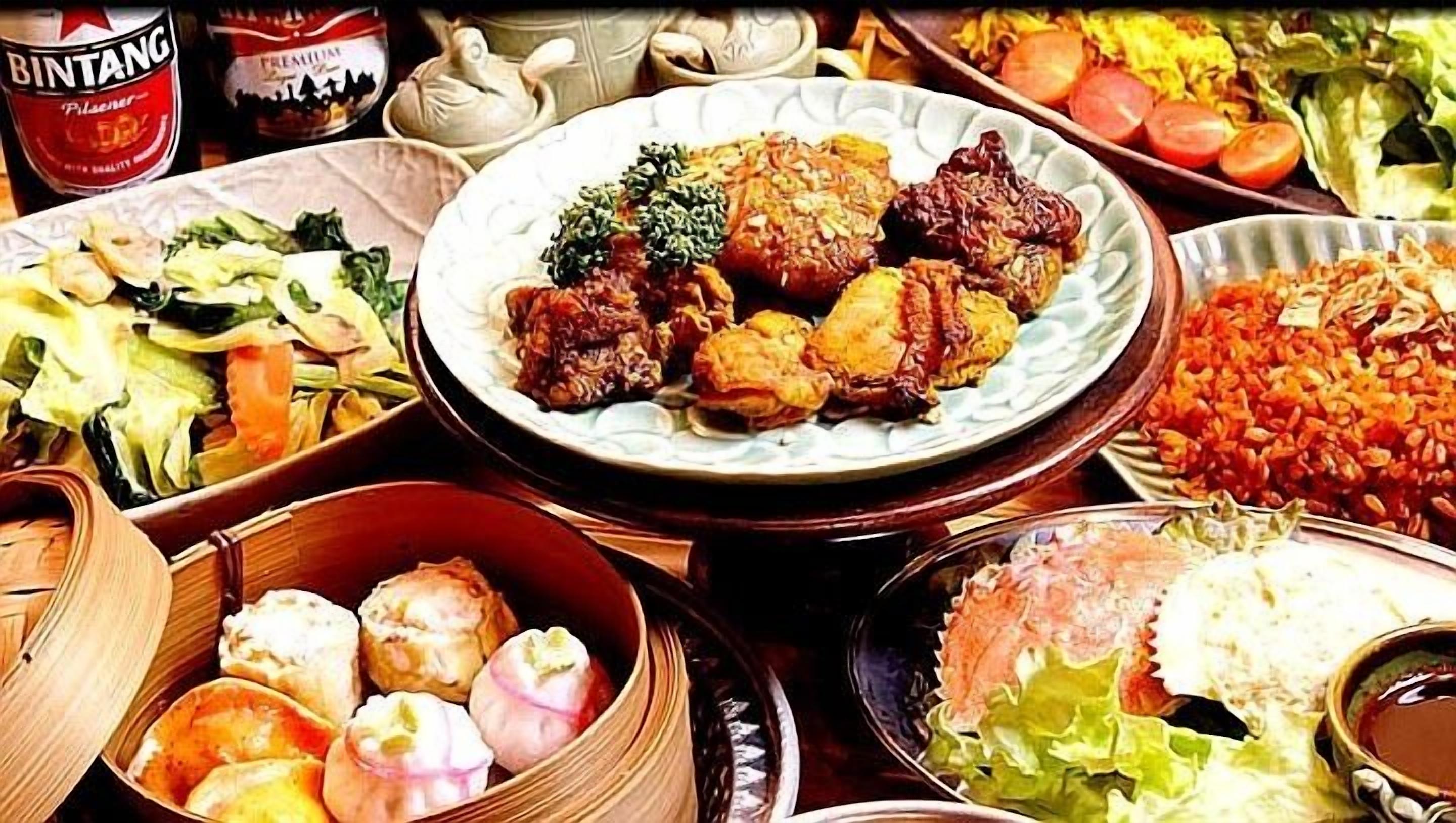 A variety of dishes including a plate of fried items, a bowl of rice, and a salad.