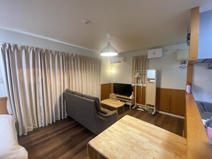 Cottage | Living area | Flat-screen TV - Bise House (Motobu)