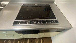 A kitchen with an induction cooktop and a built-in oven. - Bise House (Motobu)