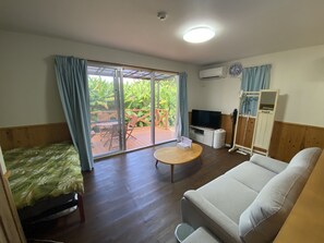 Cottage | Living area | Flat-screen TV - Bise House (Motobu)