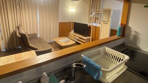 Cottage | Living area | Flat-screen TV - Bise House (Motobu)