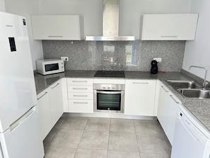 Fridge, microwave, dishwasher, coffee/tea maker