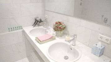 Bathtub, hair dryer, towels, soap