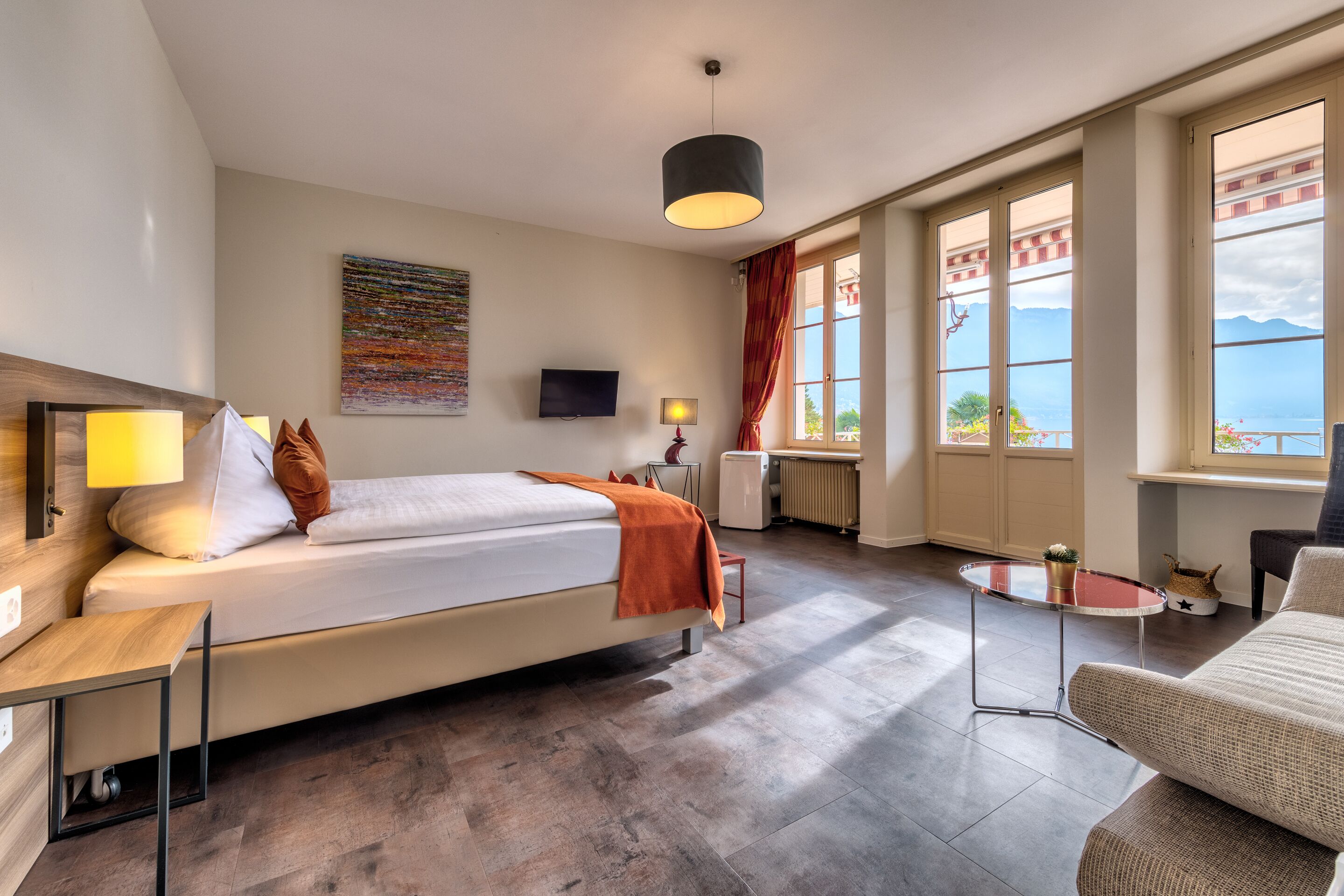 junior suite, lake view | in-room safe, soundproofing, iron/ironing board, free wifi