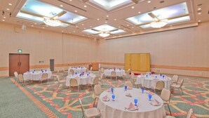 A large conference room with round tables, chairs, and a carpeted floor. - Maebashi Hotel (Maebashi)