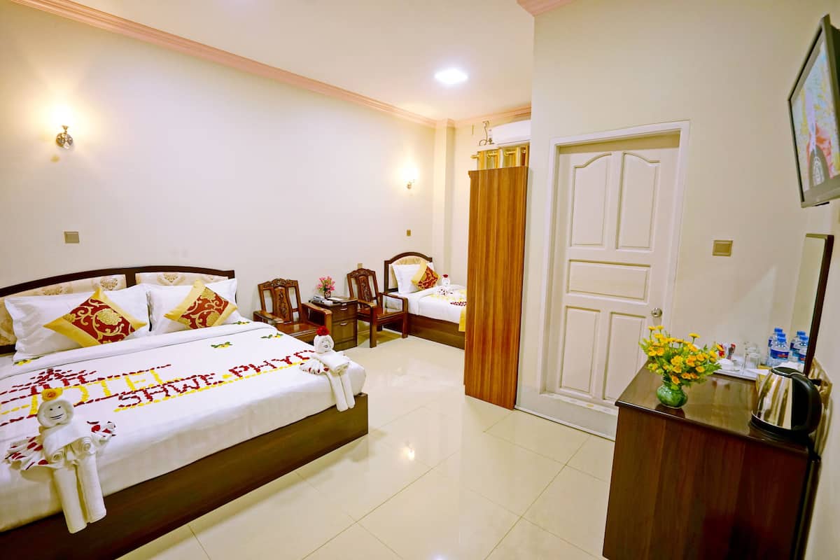 Deluxe Triple Room, 1 Bedroom, City View | Egyptian cotton sheets, minibar, in-room safe, desk