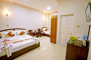Deluxe Triple Room, 1 Bedroom, City View | Egyptian cotton sheets, minibar, in-room safe, desk