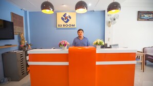 A reception desk with a blue wall and a sign that reads "S3 ROOM". - S3 Room (Sattahip)