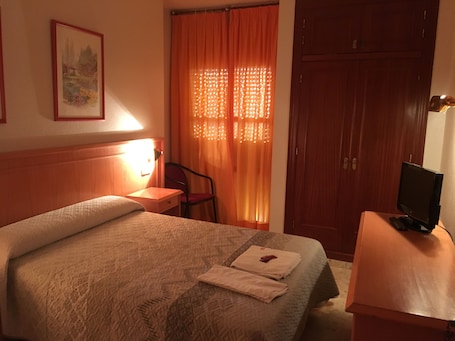Double or Twin Room | Pillowtop beds, blackout drapes, iron/ironing board, free WiFi