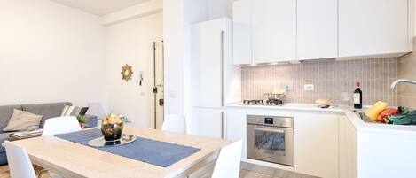 Comfort Apartment, 1 Bedroom | Private kitchen | Full-size fridge, oven, stovetop, cookware/dishes/utensils