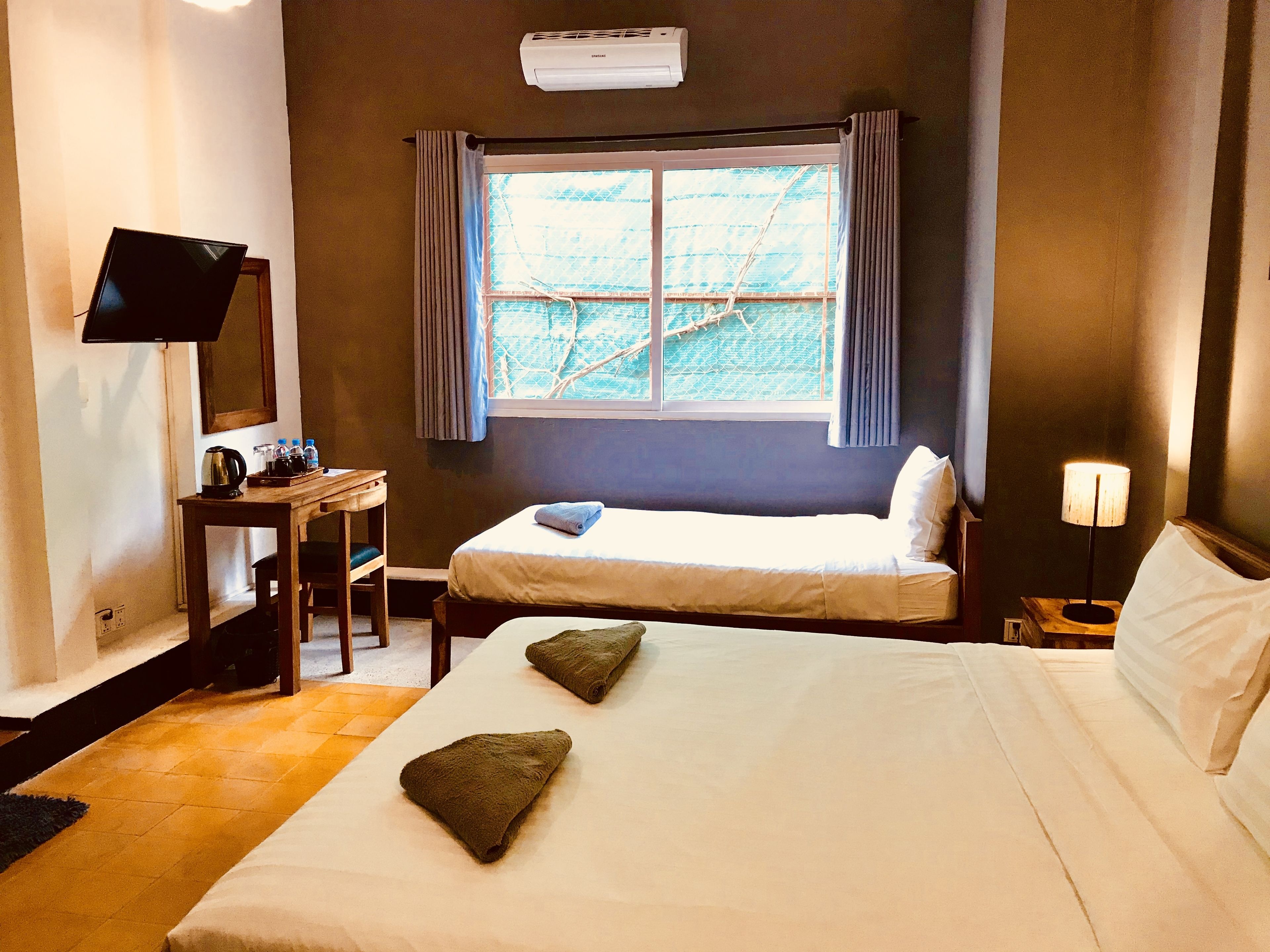 deluxe triple room | bathroom | shower, free toiletries, hair dryer, towels