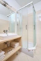 Eco-friendly toiletries, hair dryer, bidet, towels
