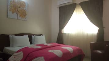 Desk, blackout curtains, free WiFi, bed sheets