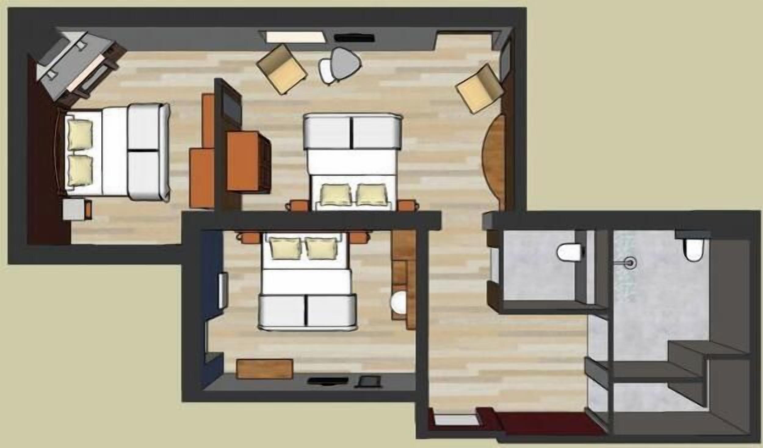 A floor plan of a hotel room with a bed, a desk, a chair, a sofa, and a bathroom.