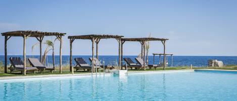 Outdoor pool, pool umbrellas, sun loungers