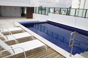 Outdoor pool, a rooftop pool, sun loungers