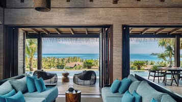 Five Bedroom Ocean View Pool Residence | Living area | 48-inch flat-screen TV with satellite channels, TV, books