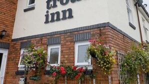 A building with a sign reading "the trout inn". - The Trout Cafe (Llanwrtyd Wells)