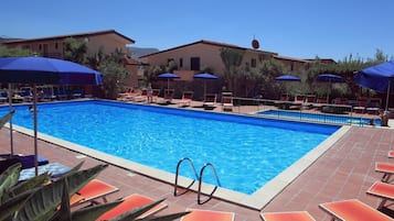 Seasonal outdoor pool, open 9:30 AM to 7:30 PM, pool umbrellas