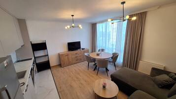 Family Suite, Multiple Beds, City View | Living area | Flat-screen TV