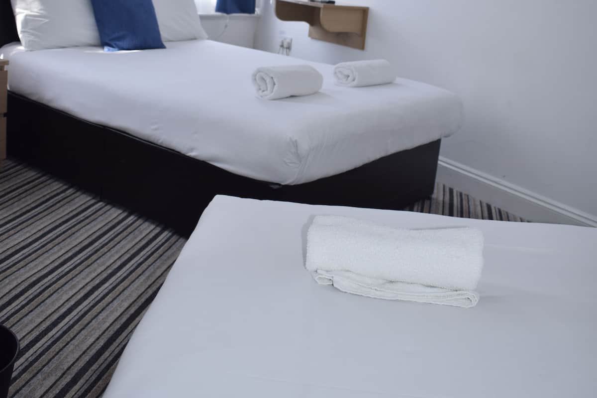 Desk, laptop workspace, free WiFi, bed sheets