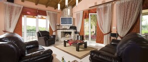 Exclusive Villa, 3 Bedrooms | Living room | 55-inch Smart TV with satellite channels, TV, fireplace - Villa Privilege Classic & Exclusive (Corfu)