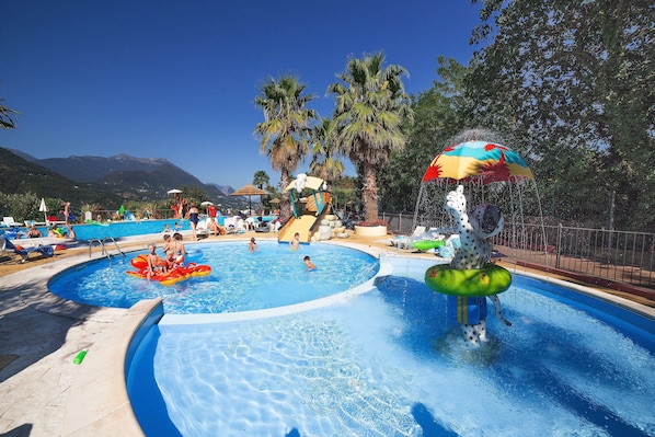 Seasonal outdoor pool, open 10 AM to 6:00 PM, pool umbrellas
