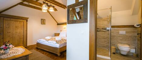 Un dormitorio con una cama de madera, una mesita de noche y un aparador. Incluye un baño con inodoro, ducha y espejo.