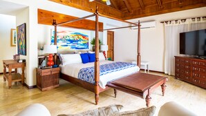 A spacious bedroom with a four-poster bed, wooden ceiling, and a ceiling fan. - Unlimited Luxury Laureanne's Villa (La Romana)