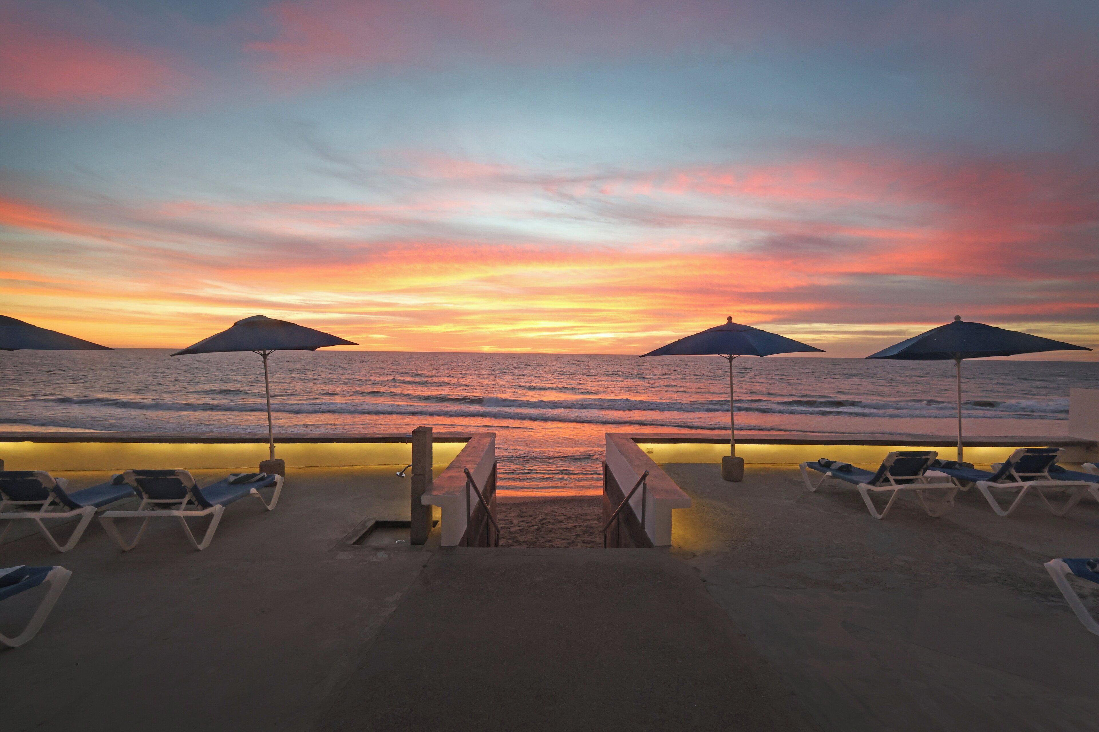 Outdoor pool, open 9:00 AM to 10:00 PM, pool umbrellas, sun loungers