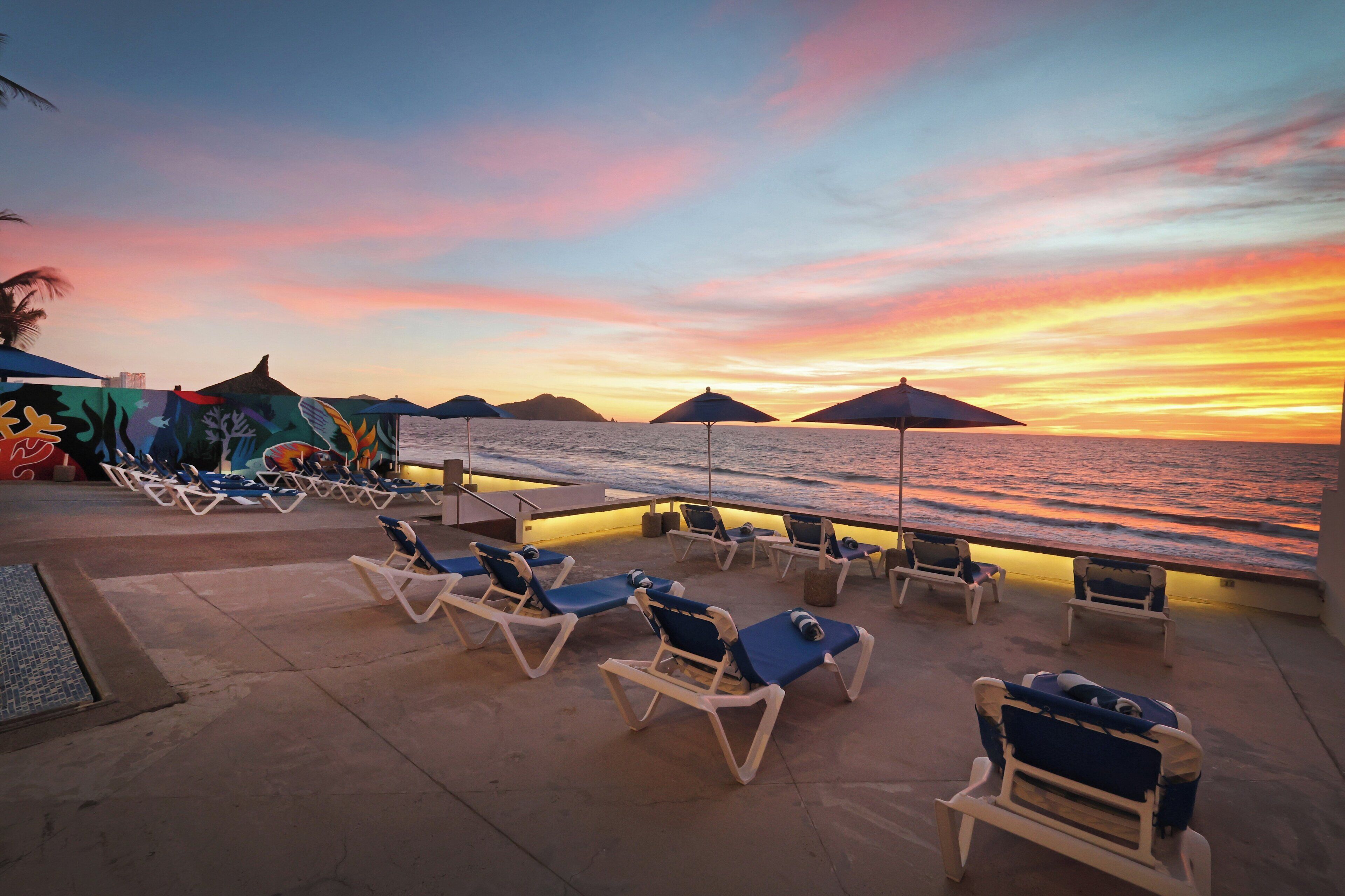 Outdoor pool, open 9:00 AM to 10:00 PM, pool umbrellas, sun loungers