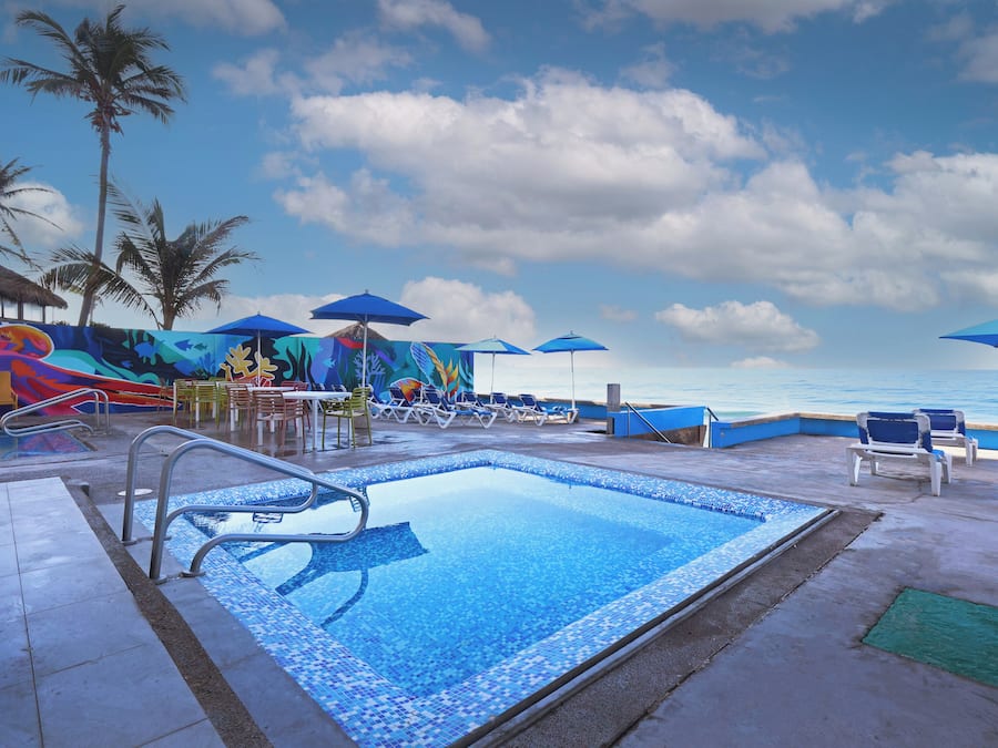 Outdoor pool, open 9:00 AM to 10:00 PM, pool umbrellas, sun loungers