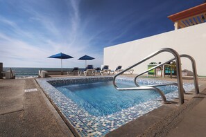 Outdoor pool, open 9:00 AM to 10:00 PM, pool umbrellas, sun loungers