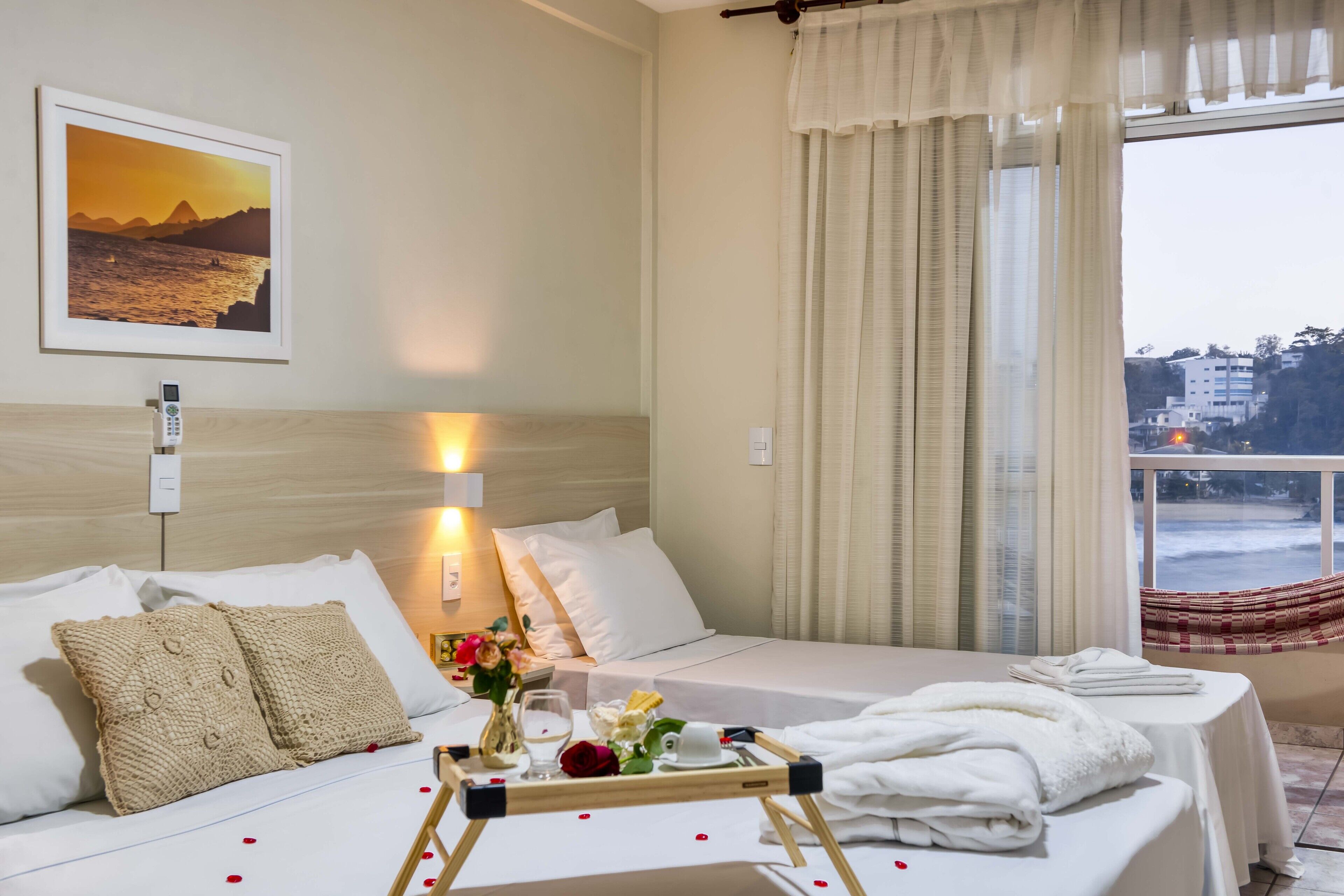 standard apartment, beach view | minibar, desk, blackout curtains, iron/ironing board